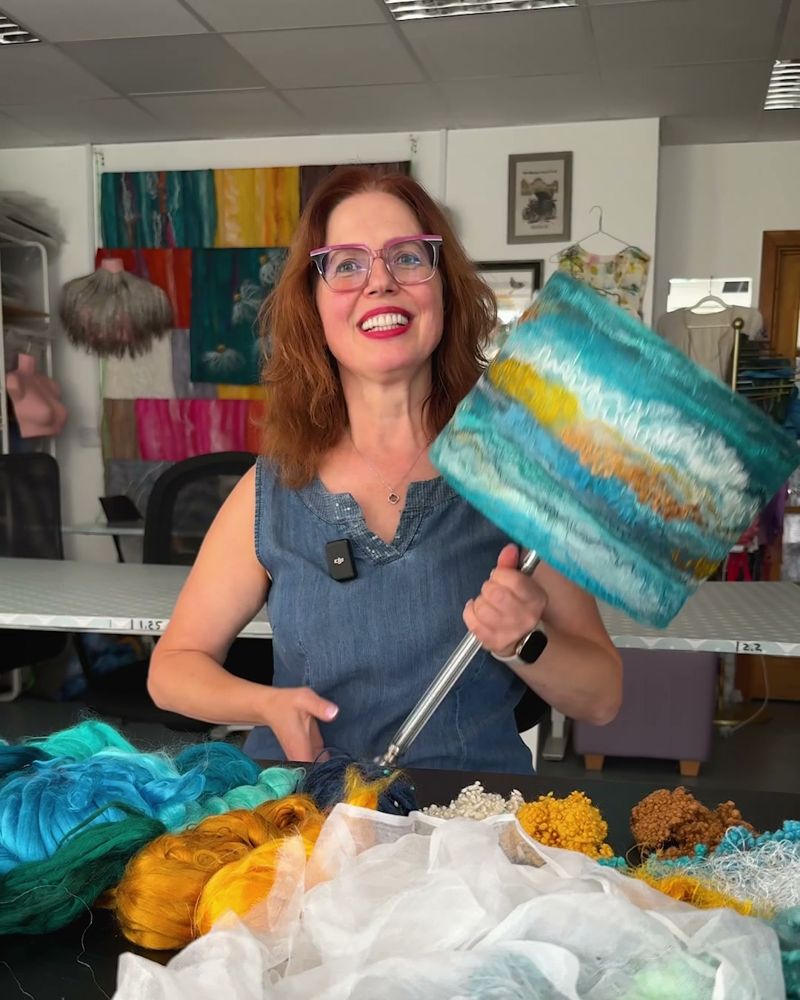 Svetlana Lilley holding a felted lampshade in her Wool & Silk studio