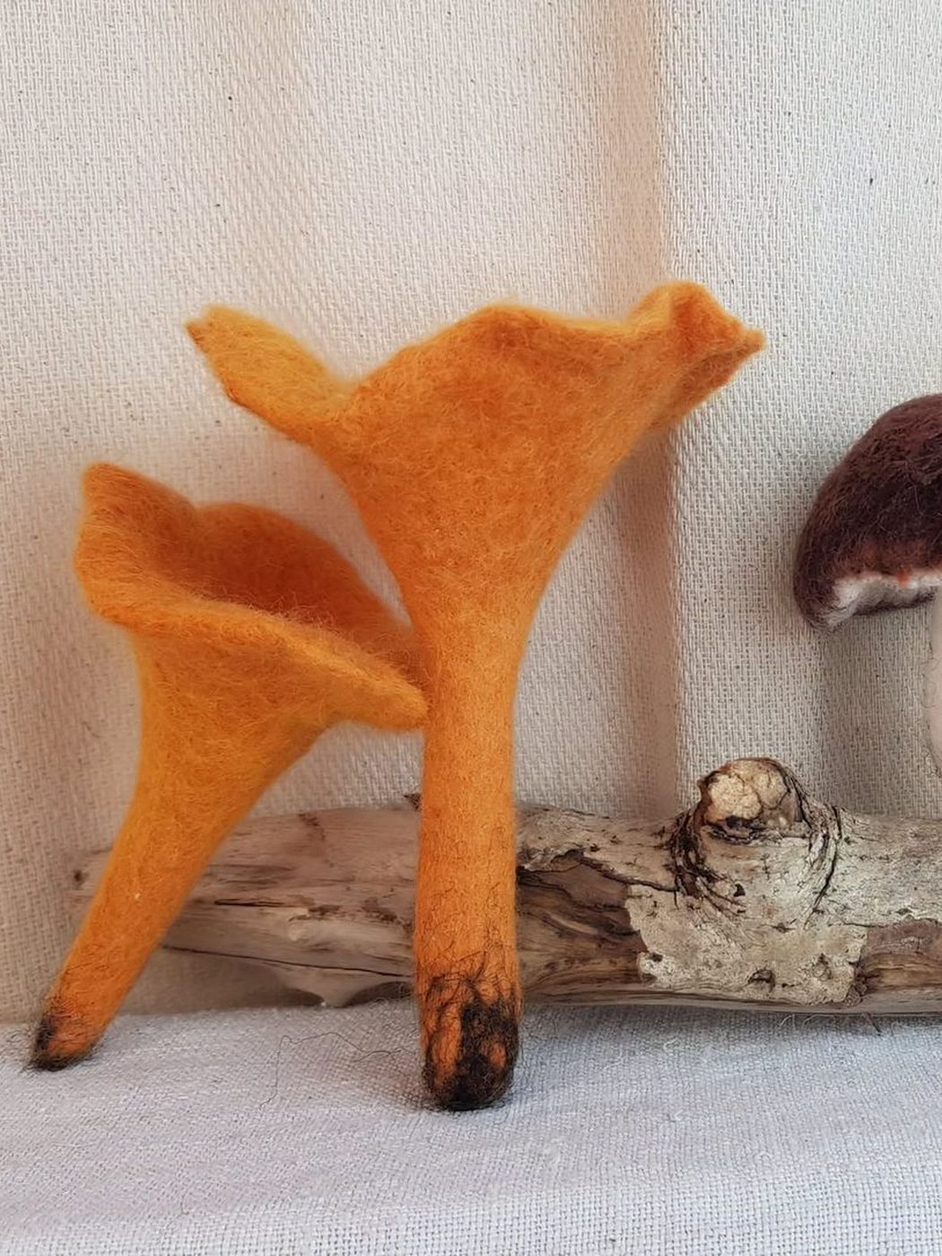 Two felted golden chanterelles